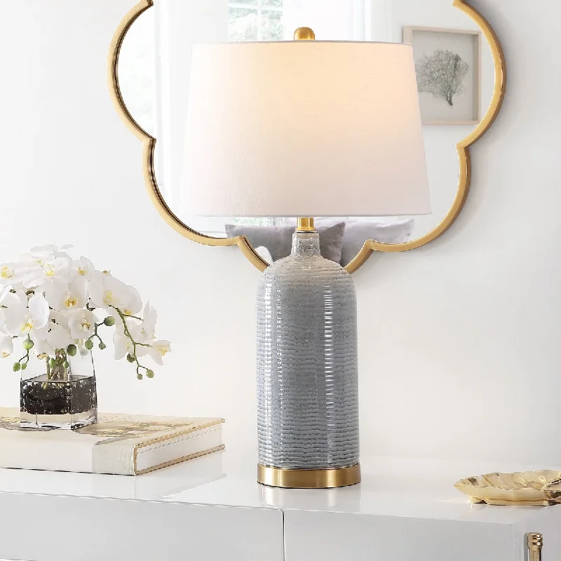 wooden table lamps with natural grain for a warm and organic feelwooden table lamps with natural grain for a warm and organic feelSAFAVIEH Lighting Branddis 26.75-inch Glass Table Lamp - 15" x 15" x 26.8" - 15Wx15Dx27H