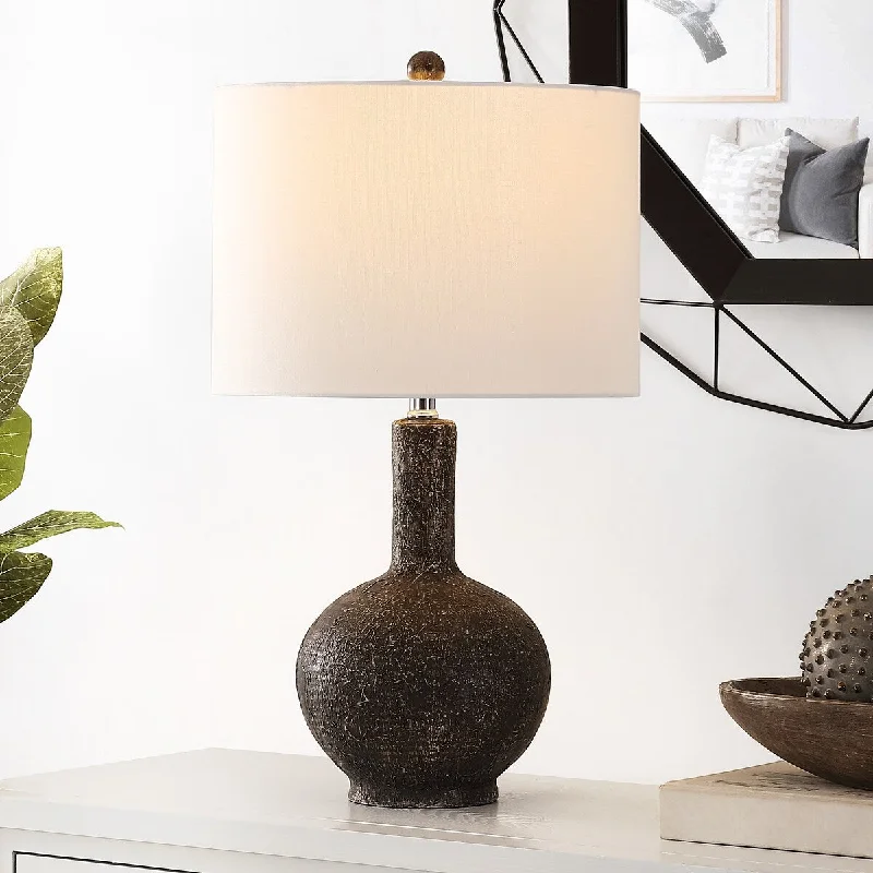 leather table lamps with a distressed texture for a rugged charmleather table lamps with a distressed texture for a rugged charmSAFAVIEH Lighting Eduina 25-inch Resin Table Lamp - 14" x 14" x 25" - 14Wx14Dx25H